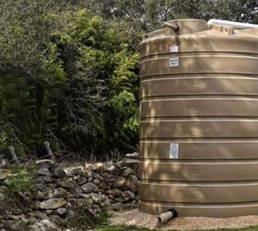 A poly water storage tank installed by TR Drilling in the Hill Country