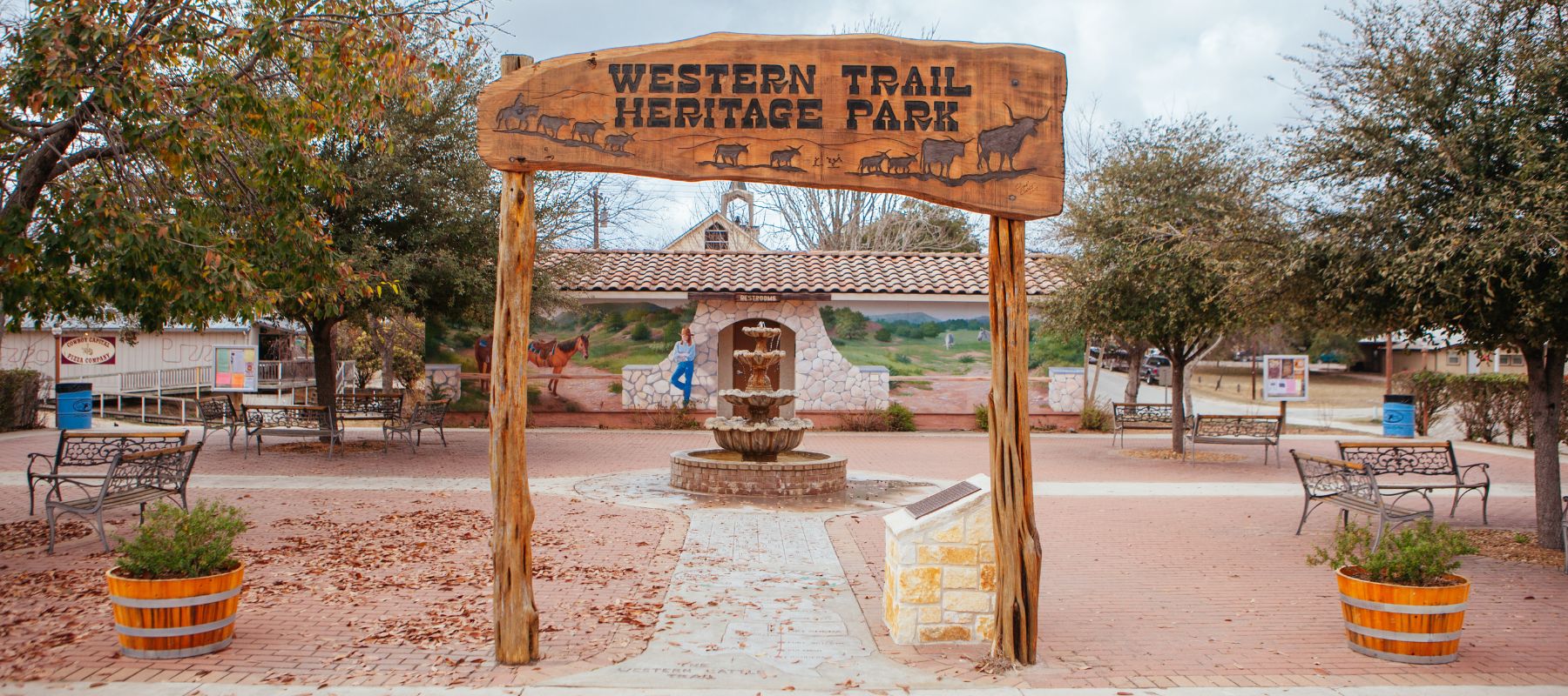 Entrance sign and fountain at Western Trail Heritage Park in Bandera, Texas