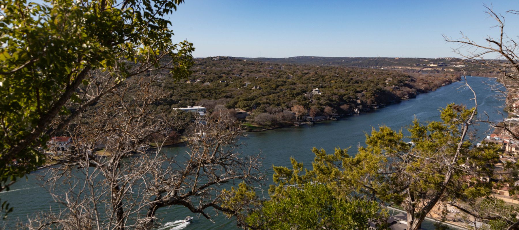 Scenic river winding through hills with trees and overlooks